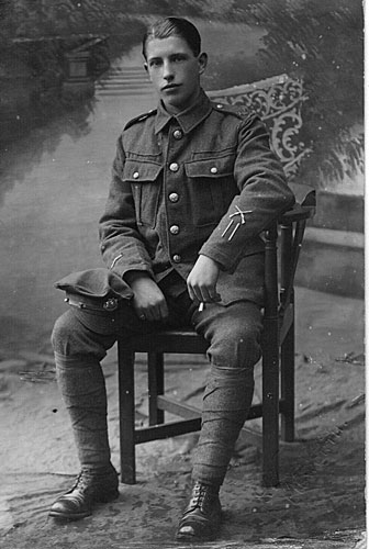 George Maynard photographed sitting on a chair.