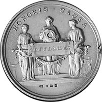 A silver replica of his gold Poetry Medal, a round medal showing three people with the words 'Honoris Causa' above.