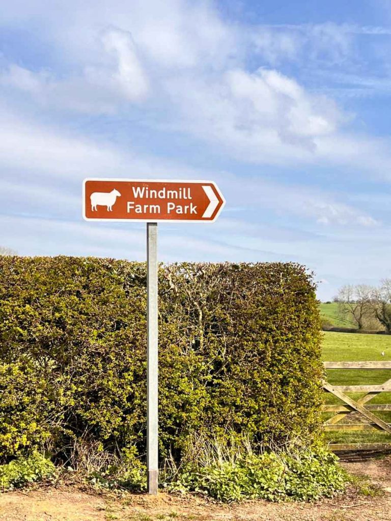 Brown tourist sign for Windmill Farm Park
