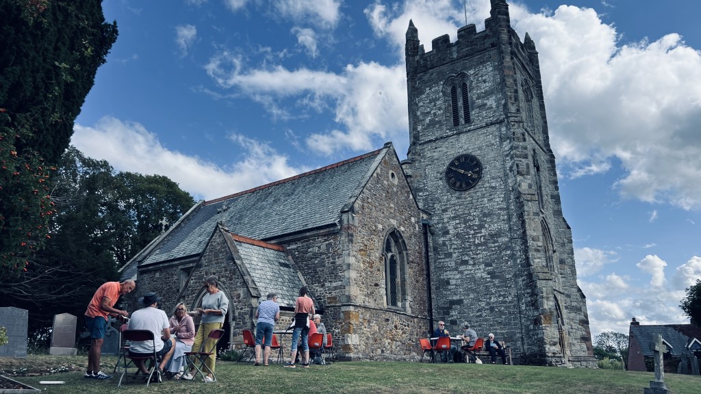 People enjoying afternoon tea outside St Peter’s Church, Arnesby
