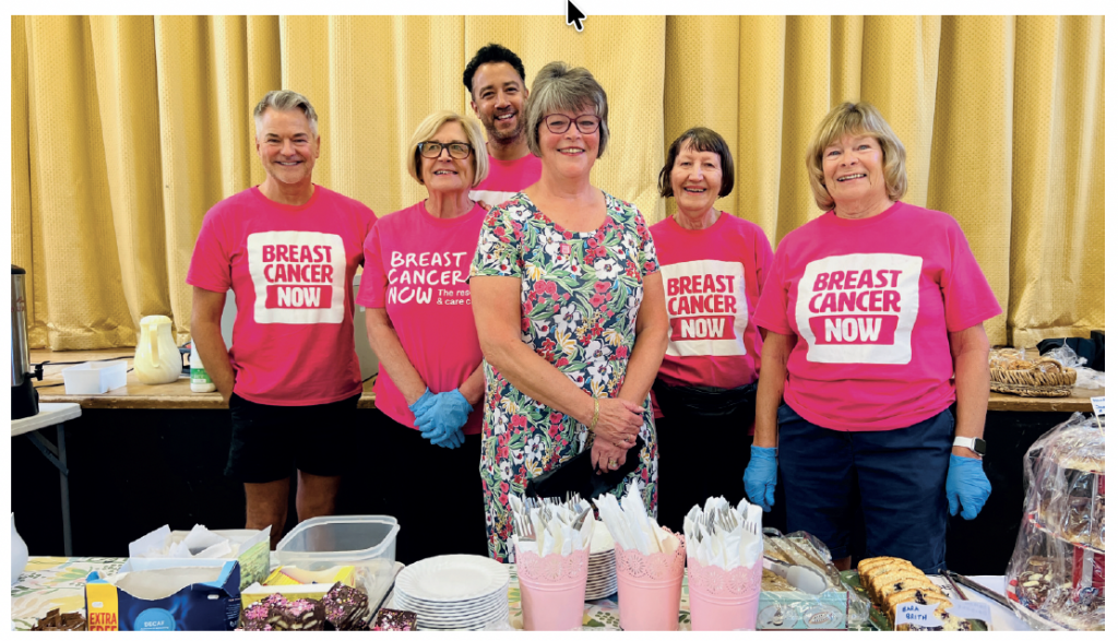 Volunteers at a Breast Cancer Now fundraising event wearing pink Breast Cancer Now shirts